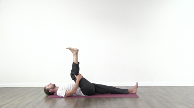 Yogi is practising yoga on a blue yoga mat on white background